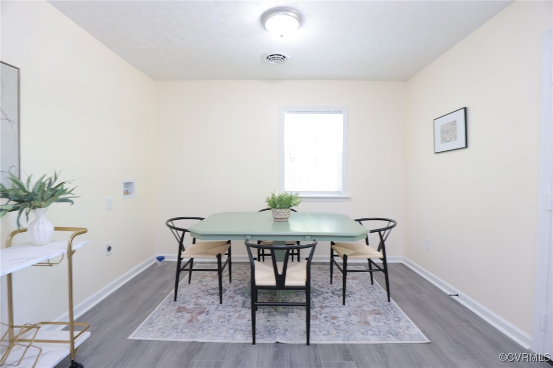 13077 Oral Oaks Road Victoria, VA 23974 - Photo 15 of 34 a view of a dining room with furniture and wooden floor