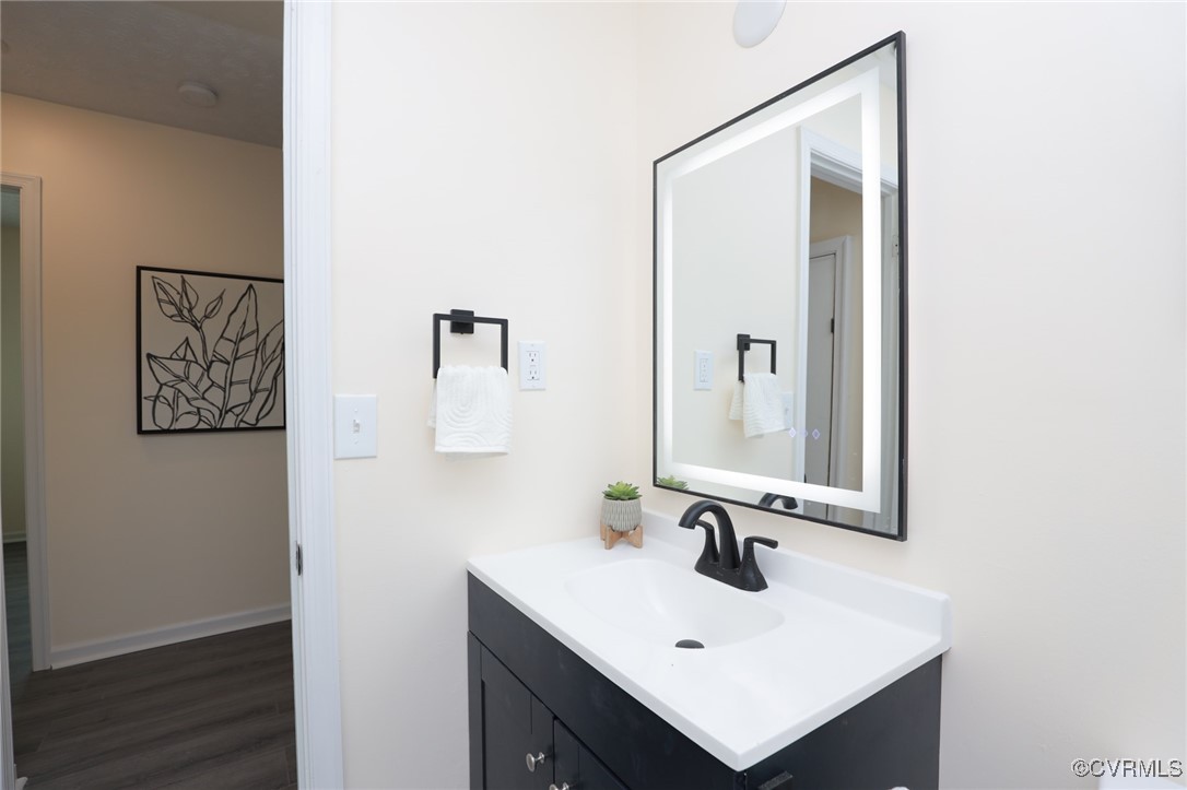 13077 Oral Oaks Road Victoria, VA 23974 - Photo 23 of 34 a bathroom with a sink mirror and vanity
