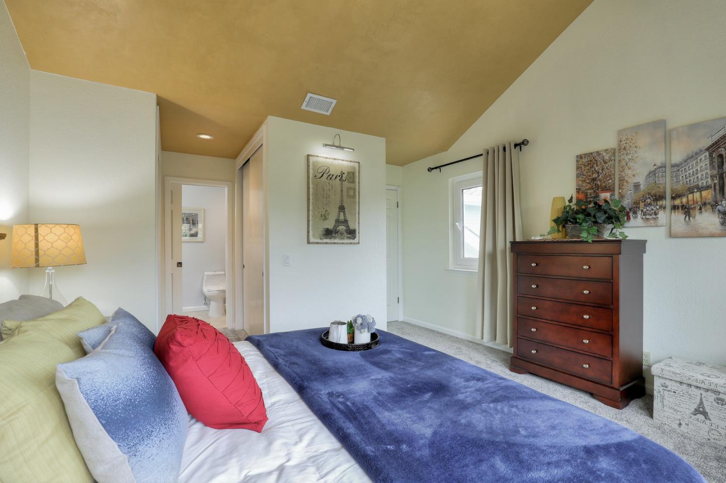 4 Muirfield Road Half Moon Bay, CA 94019 - Photo 16 of 40 a bedroom with a bed and a dresser
