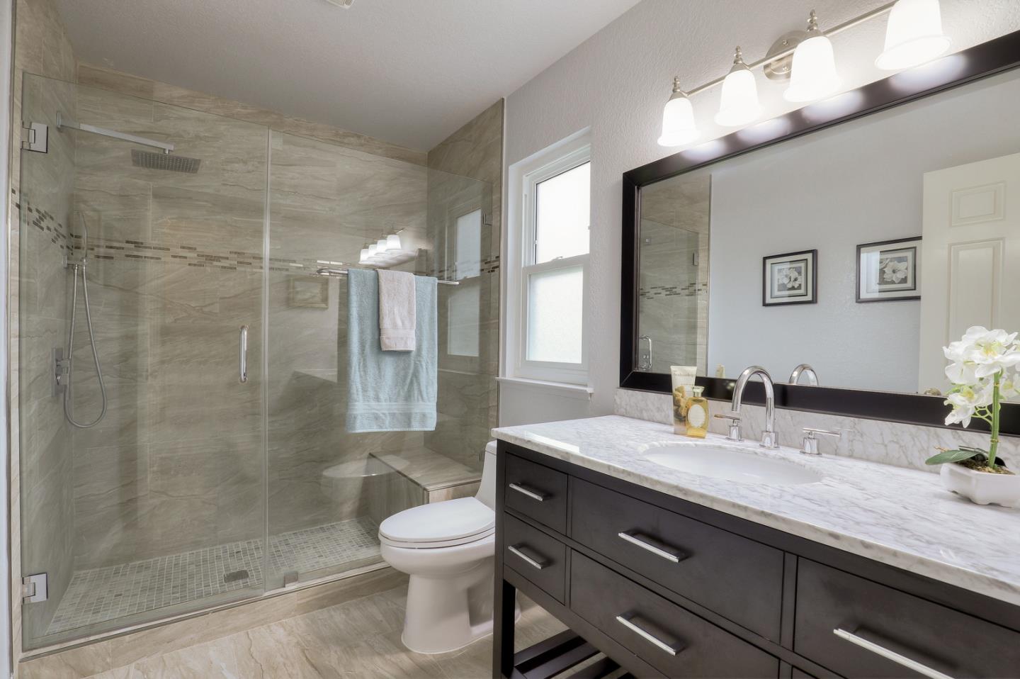 4 Muirfield Road Half Moon Bay, CA 94019 - Photo 18 of 40 a bathroom with a sink a toilet and shower