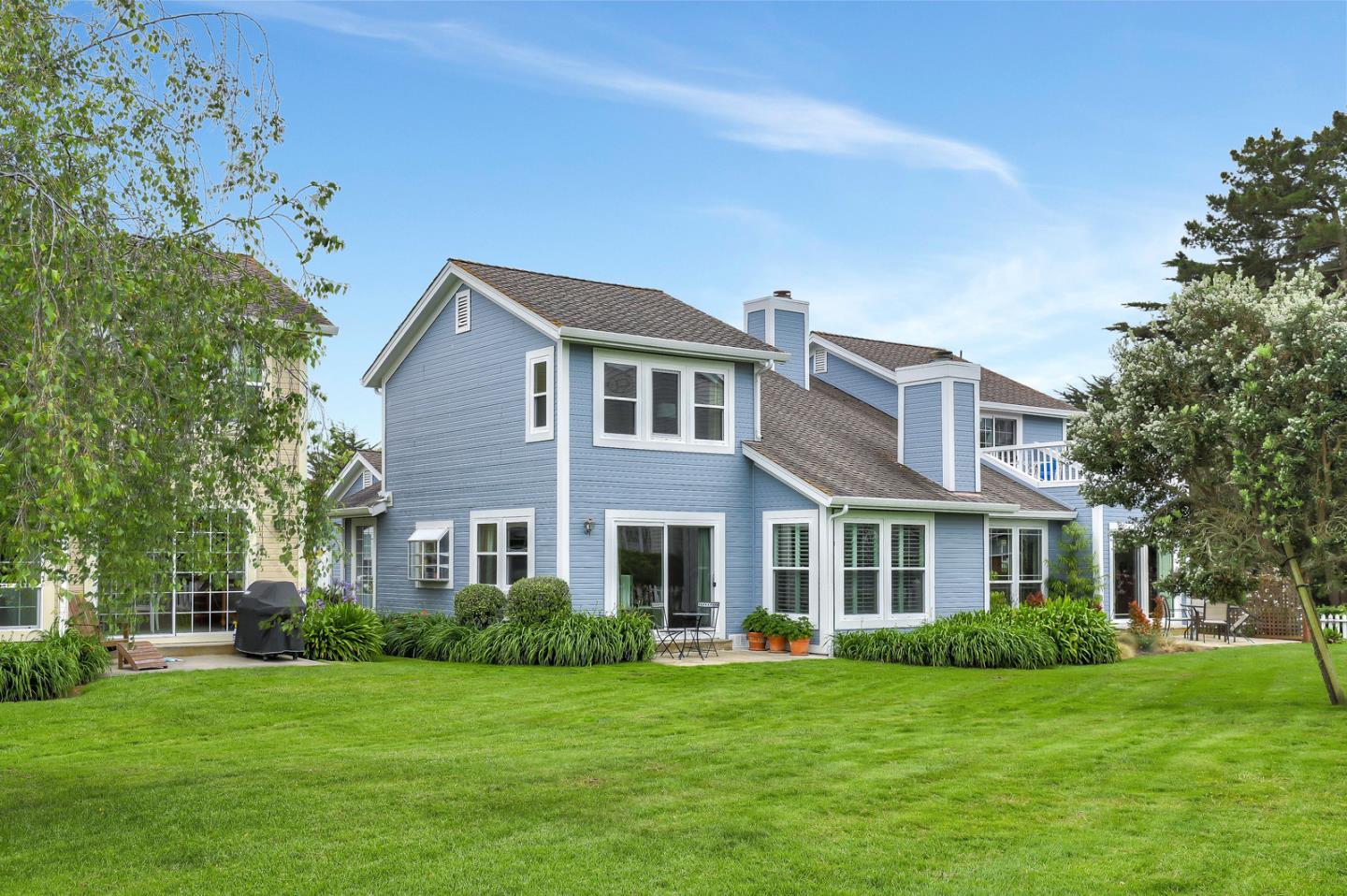 4 Muirfield Road Half Moon Bay, CA 94019 - Photo 21 of 40 a front view of a house with a garden
