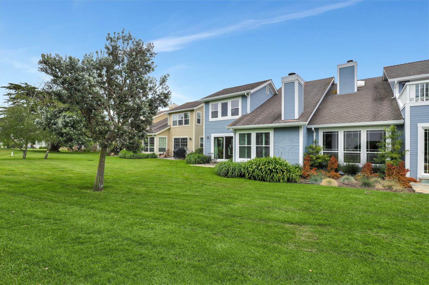 4 Muirfield Road Half Moon Bay, CA 94019 - Photo 22 of 40 a front view of a house with a yard and trees