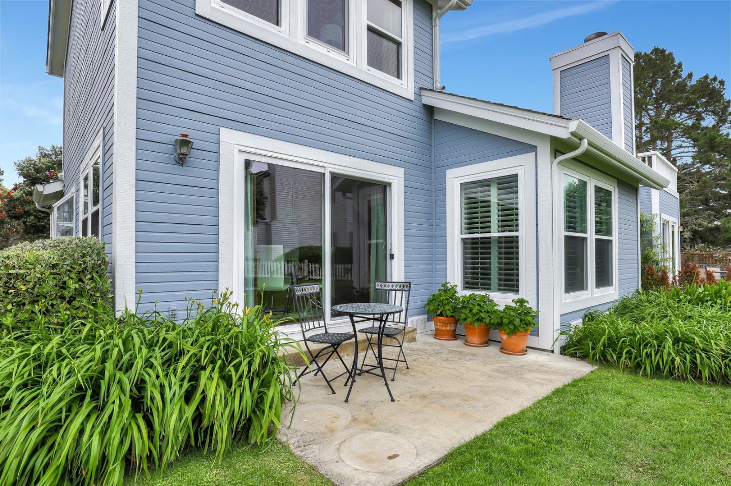 4 Muirfield Road Half Moon Bay, CA 94019 - Photo 25 of 40 a view of a house with a patio and a yard