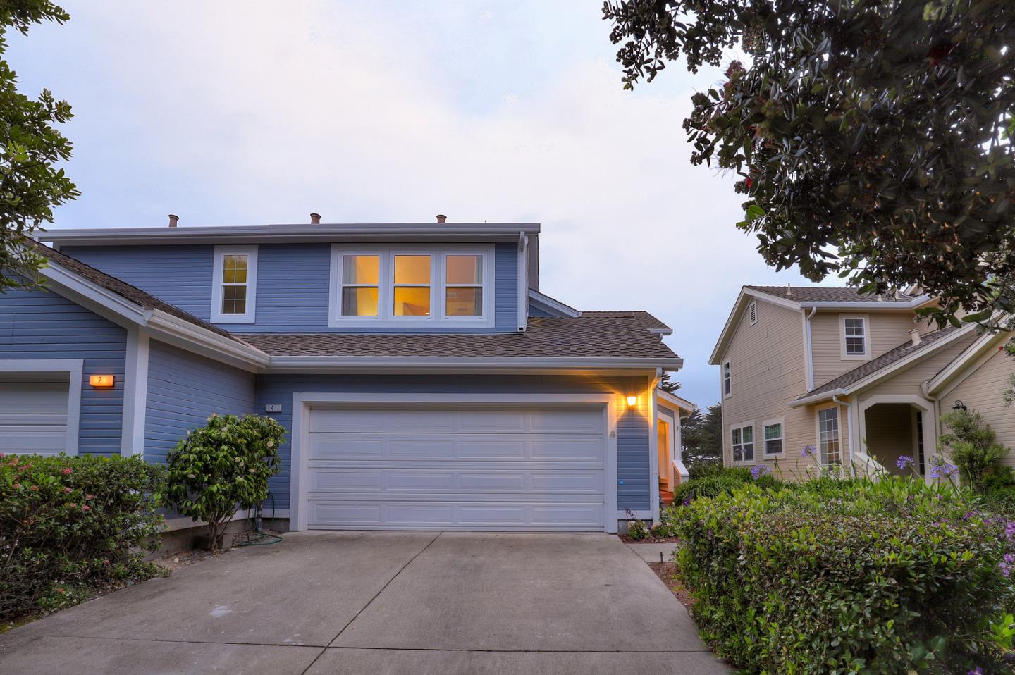 4 Muirfield Road Half Moon Bay, CA 94019 - Photo 4 of 40 a front view of a house with garden