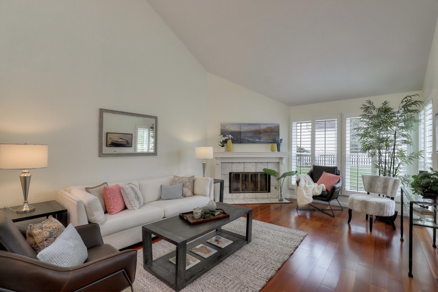 4 Muirfield Road Half Moon Bay, CA 94019 - Photo 10 of 40 a living room with furniture fireplace and a table