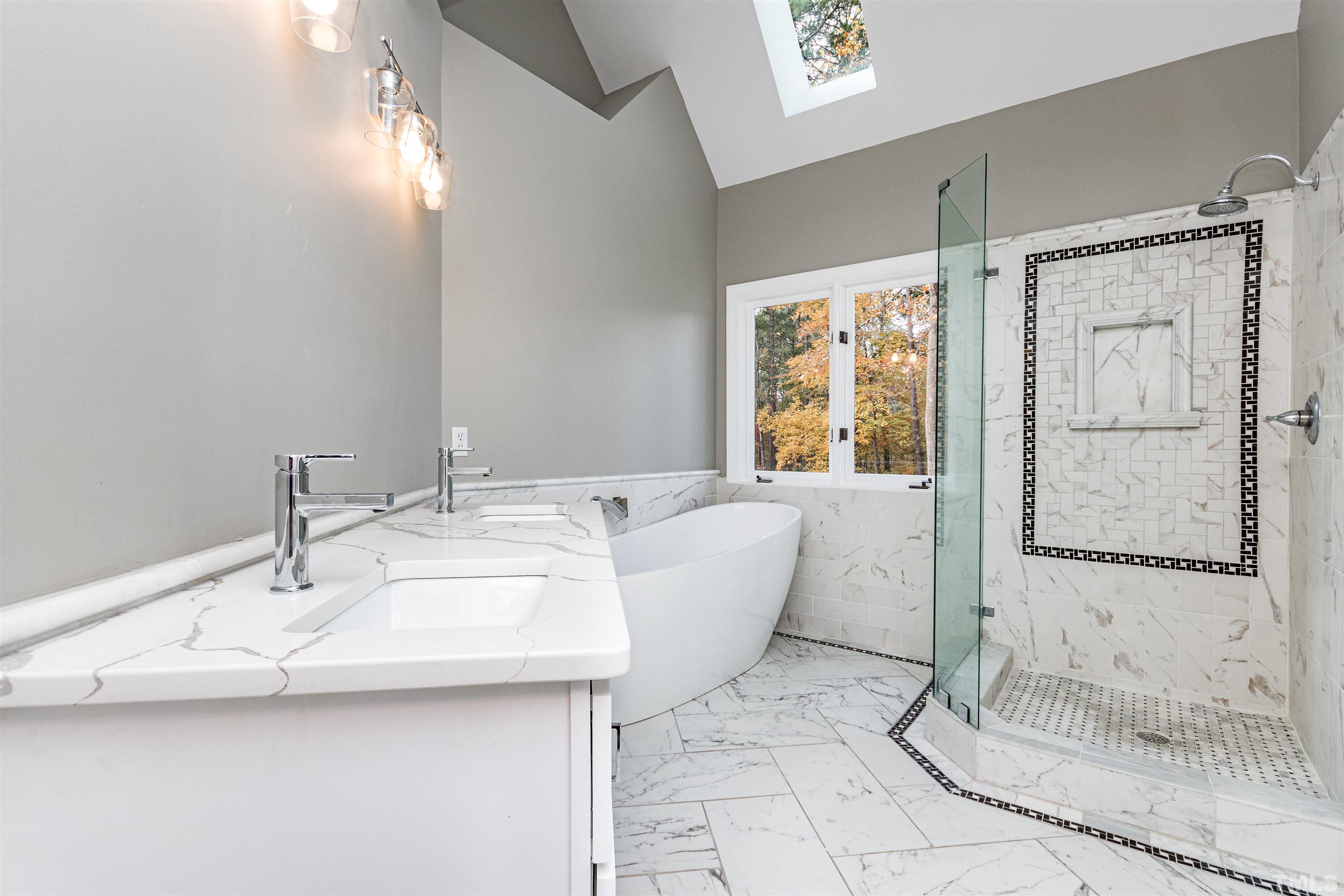 8105 Laurel Mountain Road Raleigh, NC 27613 - Photo 14 of 26 a bath room with a sink and a mirror