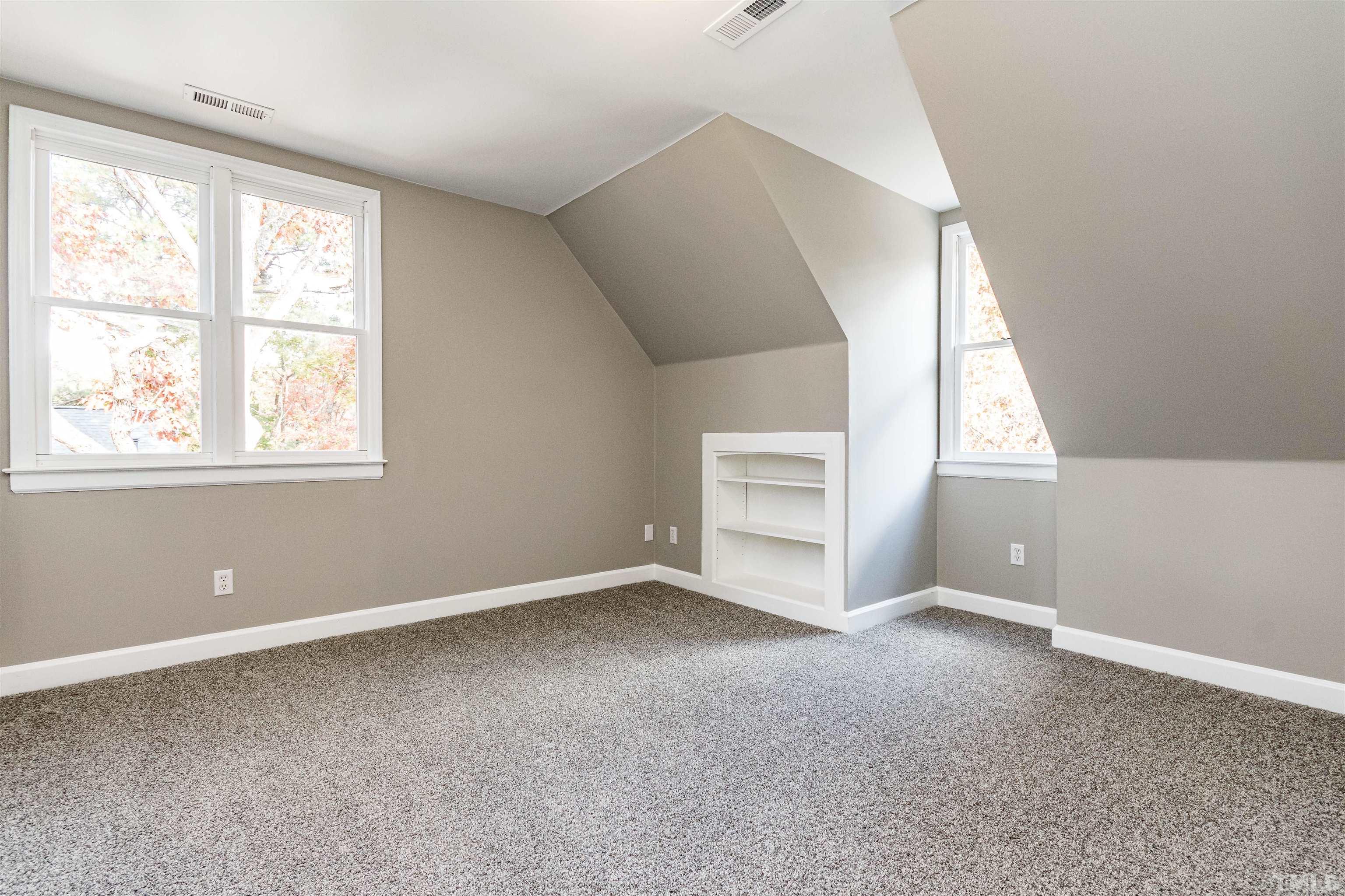 8105 Laurel Mountain Road Raleigh, NC 27613 - Photo 20 of 26 an empty room with windows