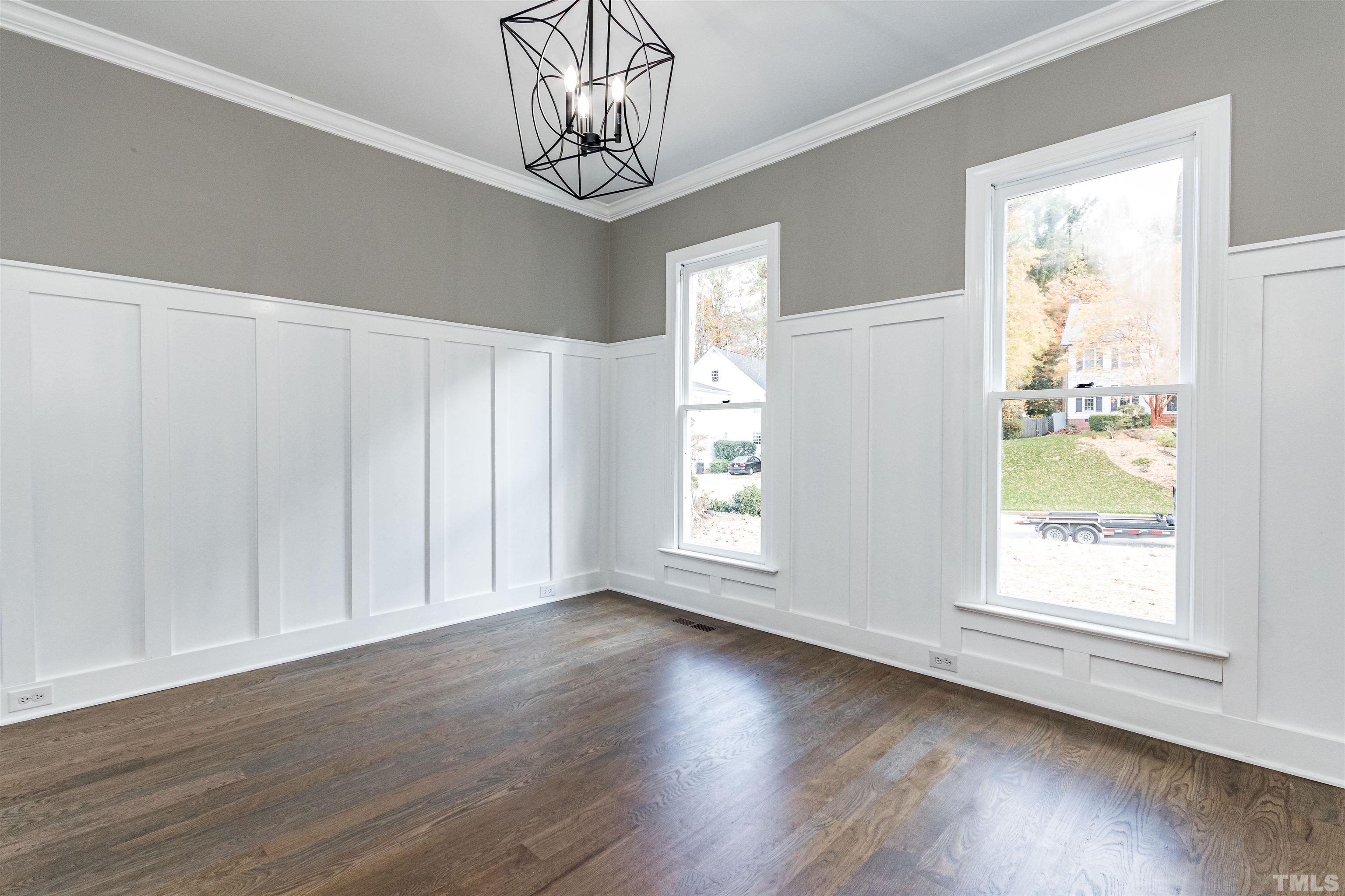 8105 Laurel Mountain Road Raleigh, NC 27613 - Photo 23 of 26 a view of a livingroom with a window and wooden floor