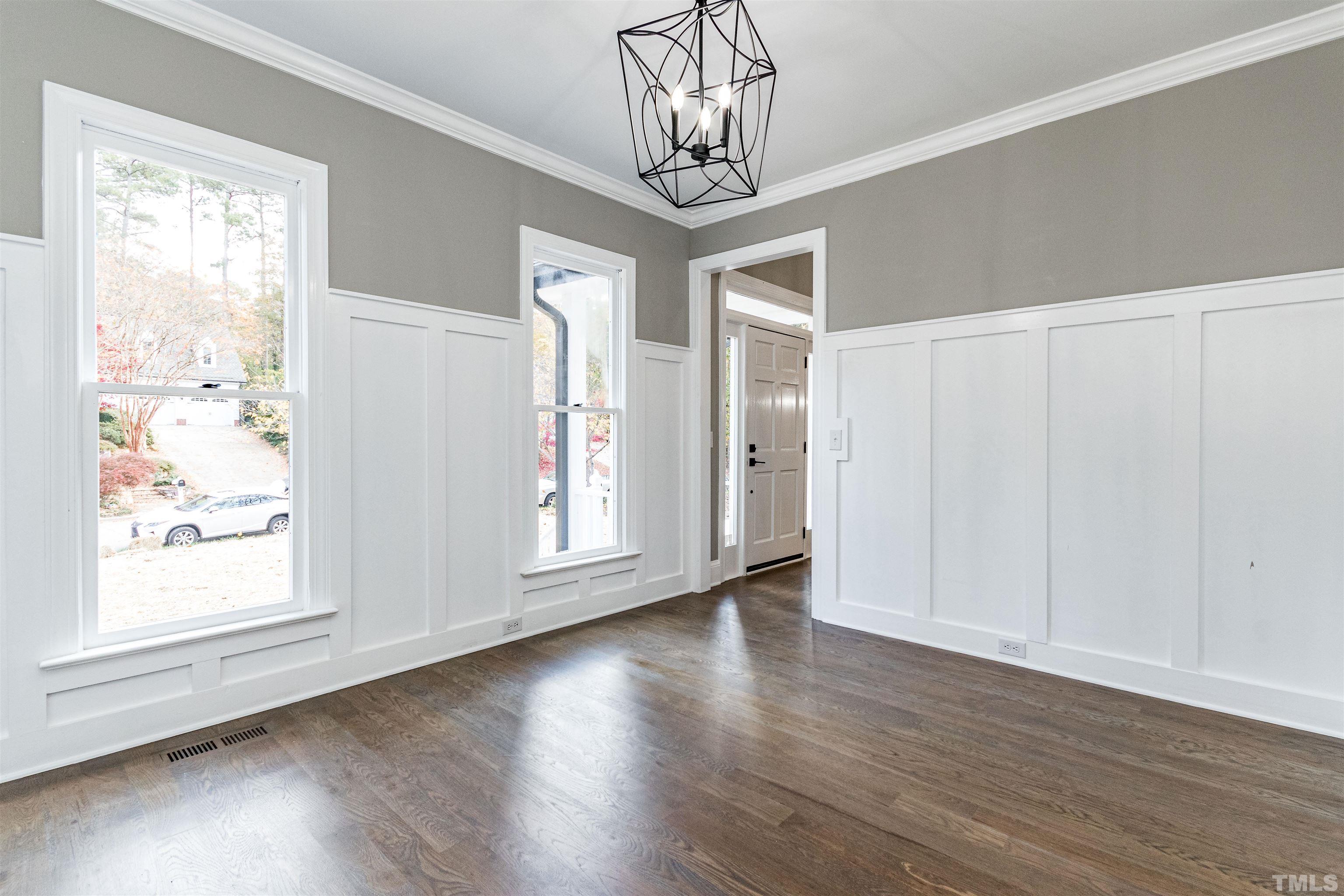 8105 Laurel Mountain Road Raleigh, NC 27613 - Photo 24 of 26 a view of empty room with wooden floor and fan
