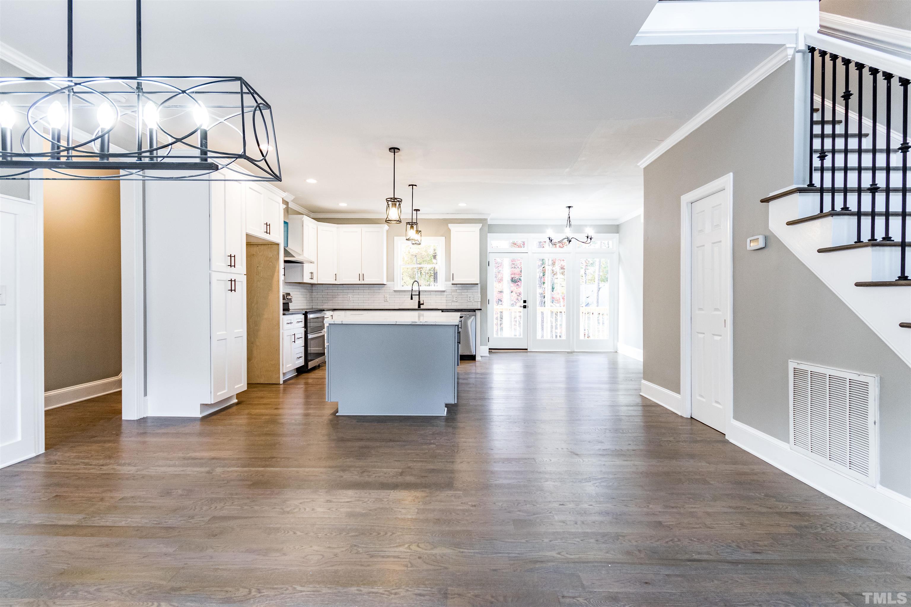 8105 Laurel Mountain Road Raleigh, NC 27613 - Photo 25 of 26 a view of a kitchen with a refrigerator and microwave