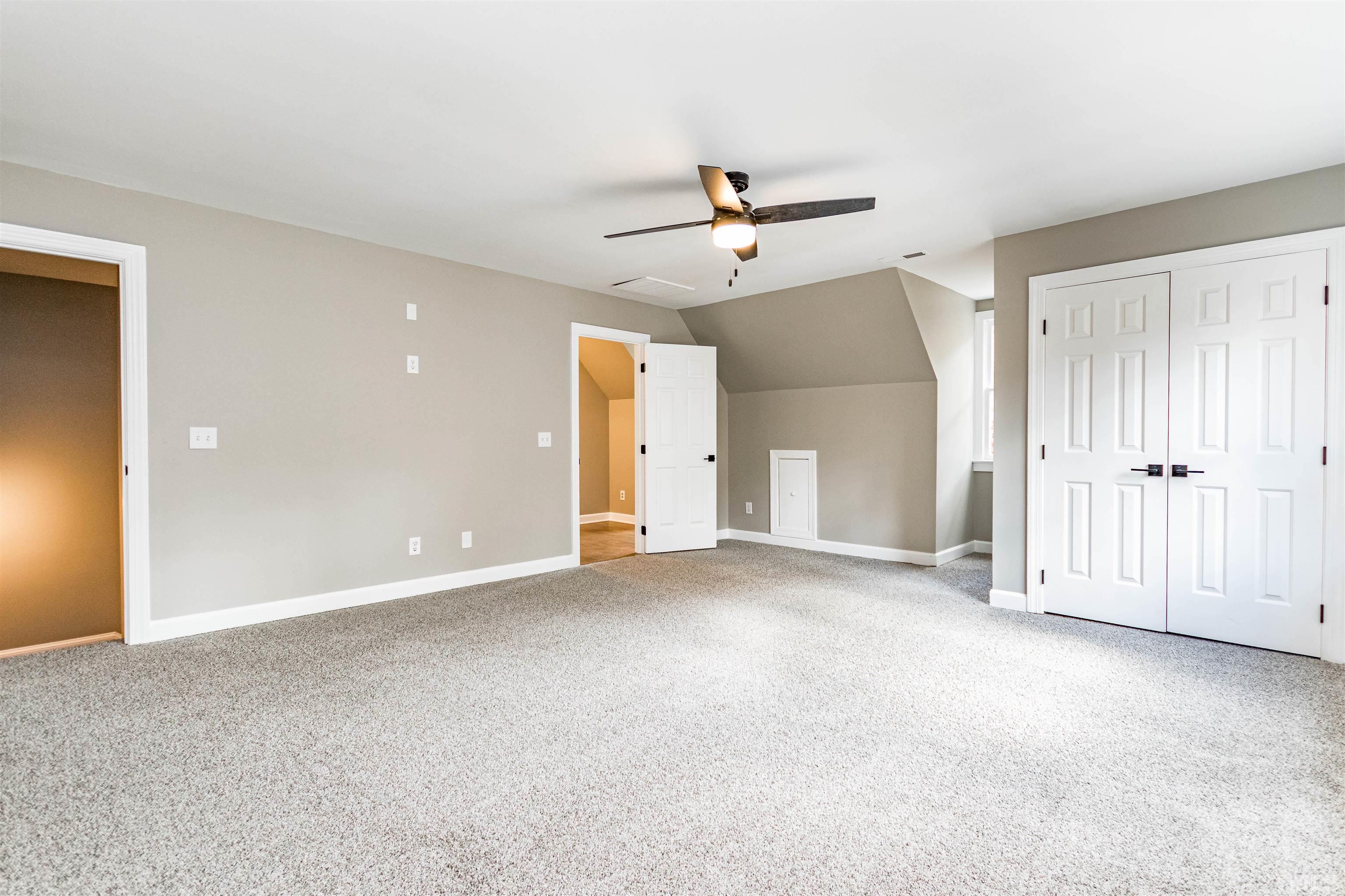 8105 Laurel Mountain Road Raleigh, NC 27613 - Photo 6 of 26 a view of a big room with carpet