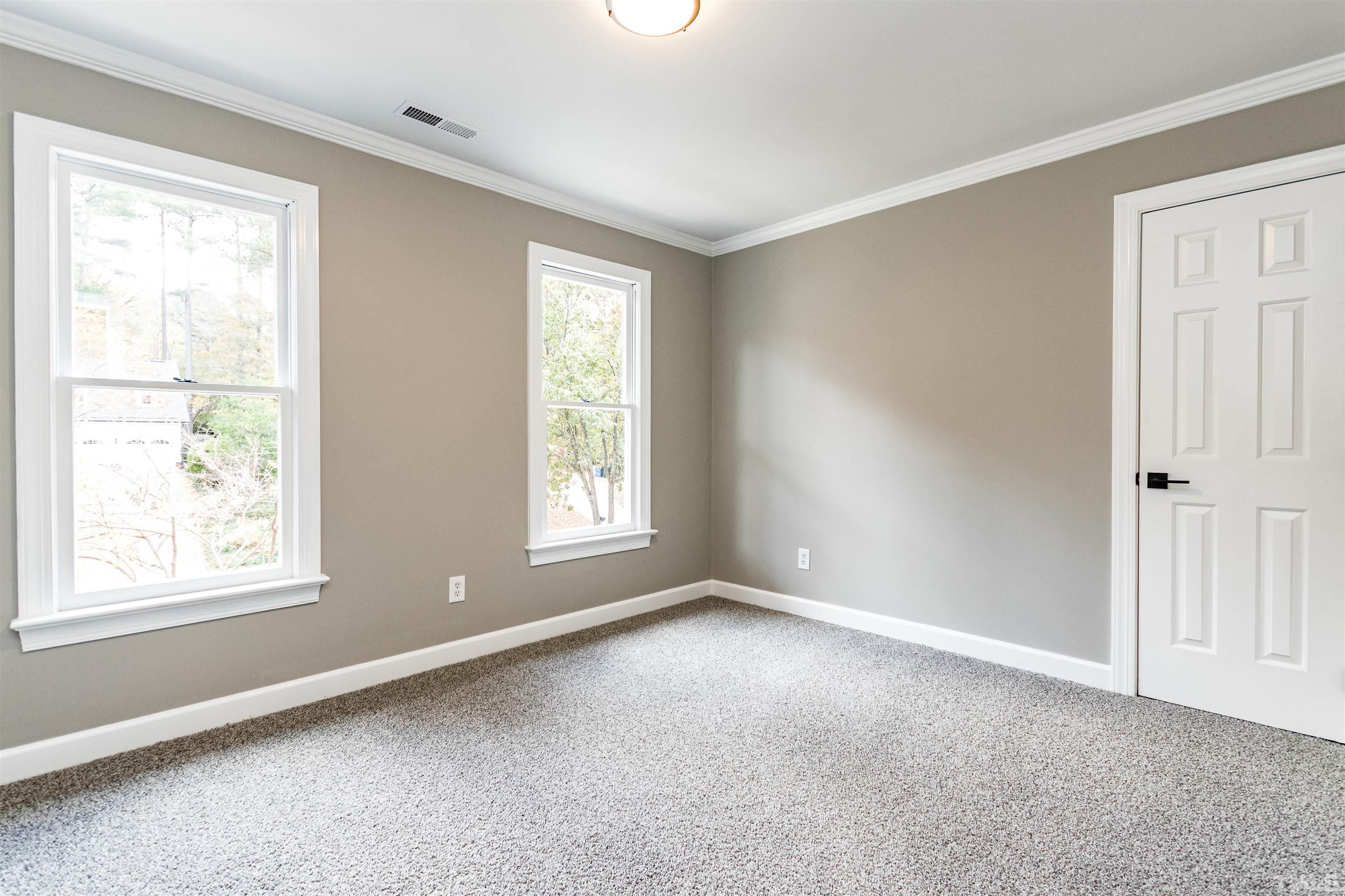 8105 Laurel Mountain Road Raleigh, NC 27613 - Photo 7 of 26 a view of an empty room with a window