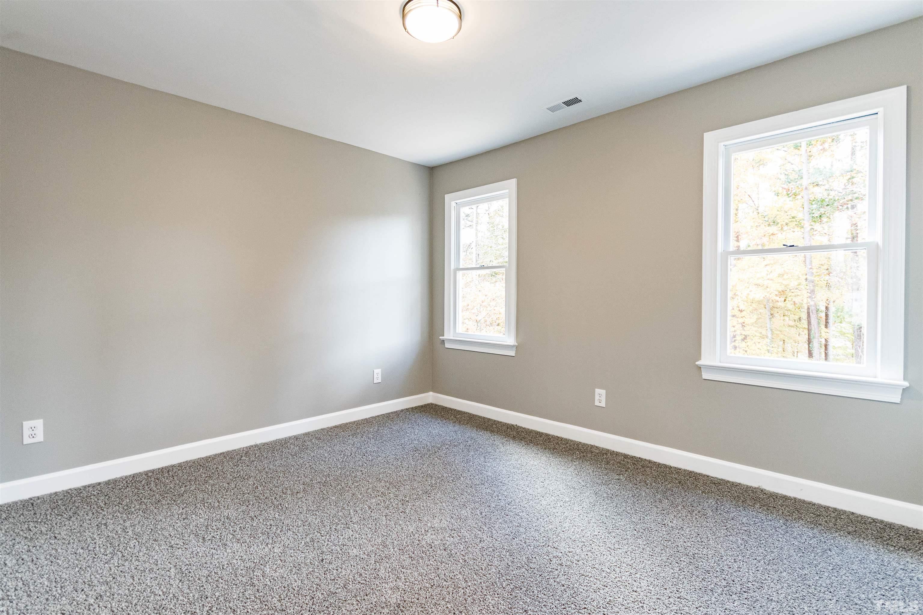 8105 Laurel Mountain Road Raleigh, NC 27613 - Photo 8 of 26 an empty room with a window