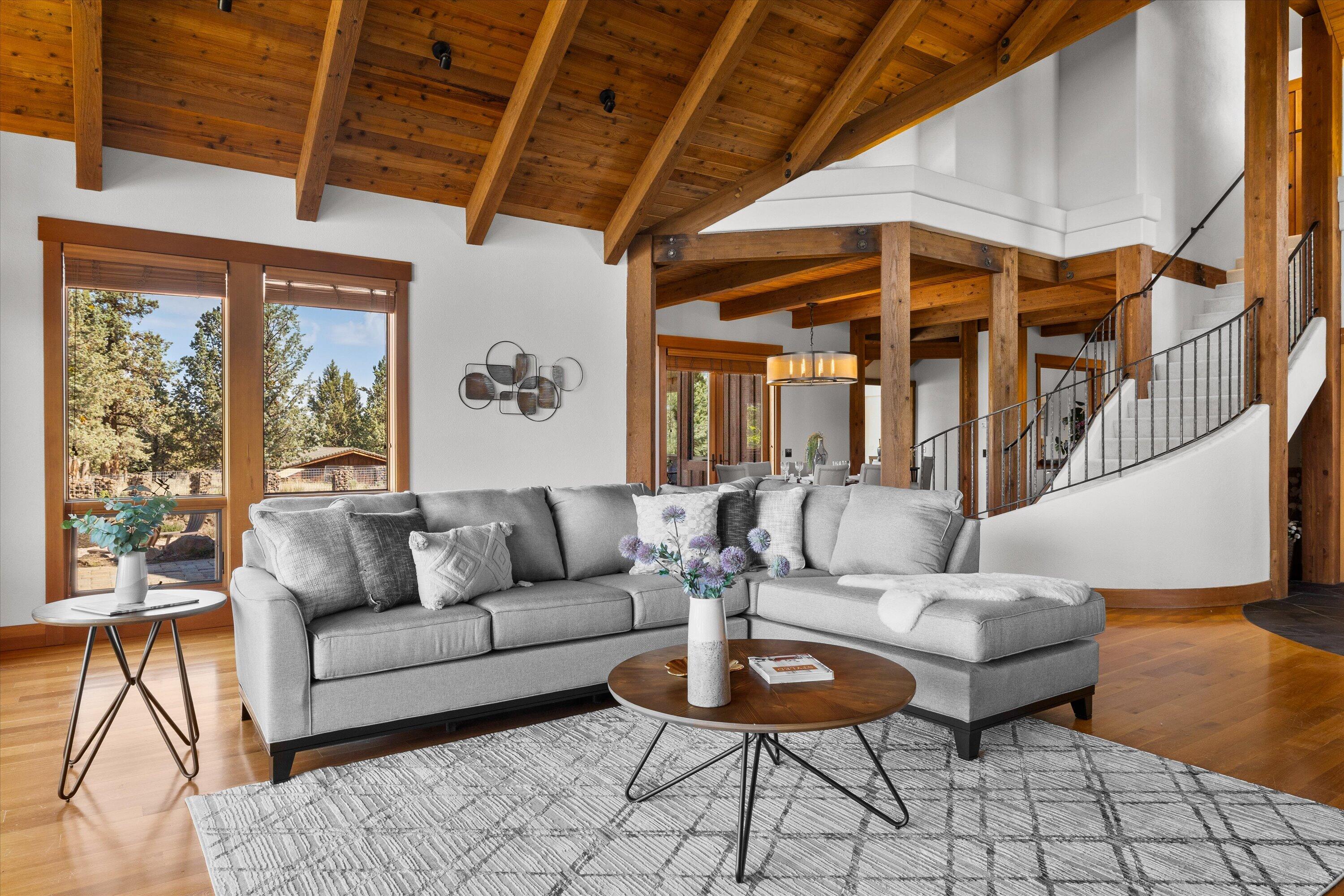 64155 Hunnell Road Bend, OR 97703 - Photo 11 of 96 A curved staircase with iron railing lends a graceful presence.