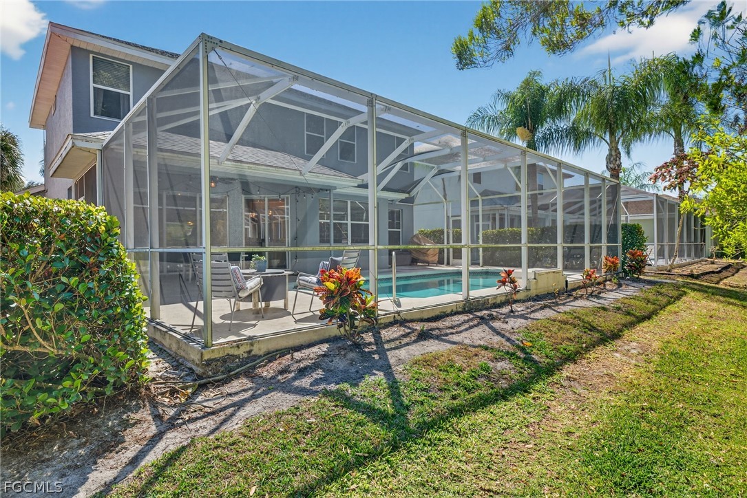 22866 Forest Ridge Drive Estero, FL 33928 - Photo 33 of 38 a view of a house with backyard and sitting area