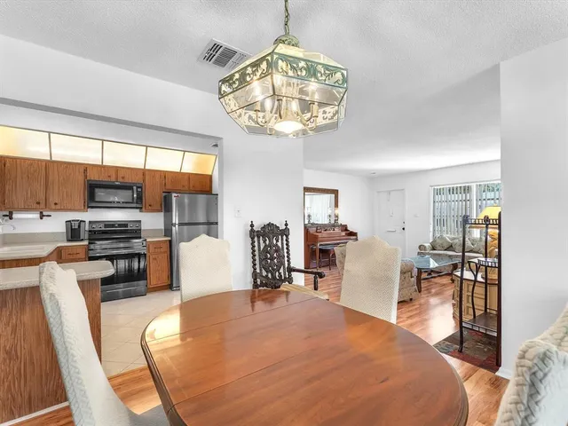 a bed room with furniture and a kitchen