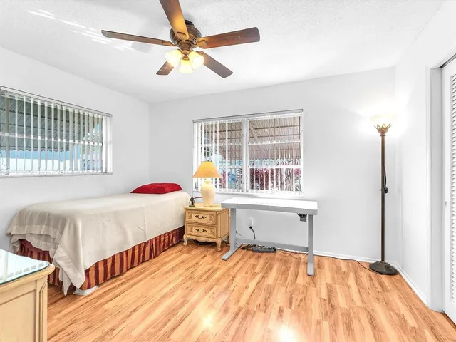 a bedroom with a bed and a table