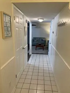 a view of an empty room and a window