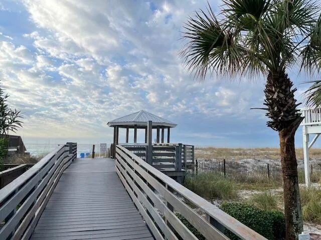 a view of a balcony with wooden floor