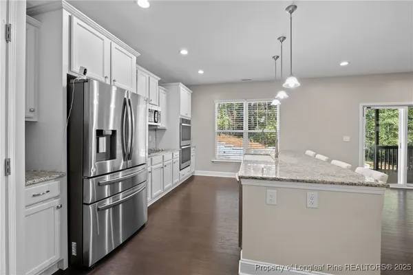 a outdoor space with wooden floor and mountain view
