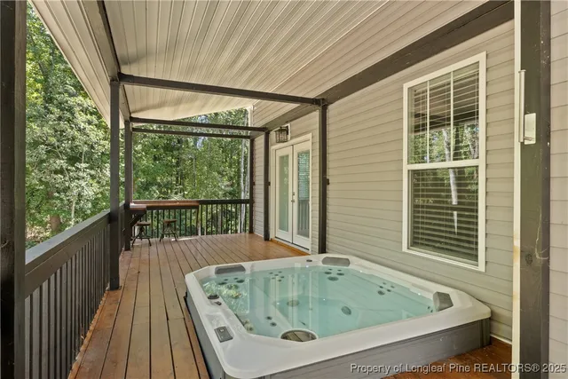a bathroom with bathtub and window