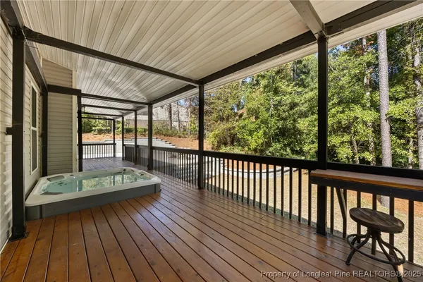 a bathroom with a granite countertop sink toilet a large mirror a bathtub and shower
