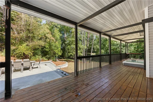 a outdoor space with wooden floor and mountain view
