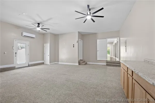 an empty room with a ceiling fan