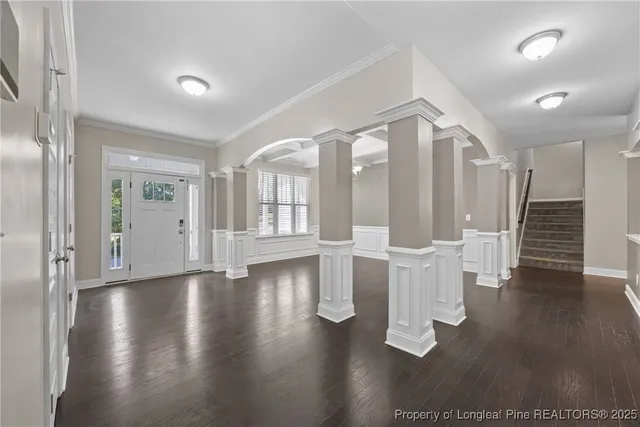 a view of an entryway with wooden floor