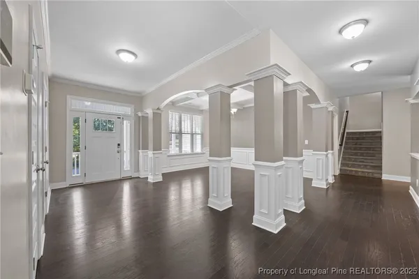 a view of a livingroom with a ceiling fan and window