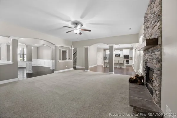 a kitchen with stainless steel appliances granite countertop a stove a microwave and a refrigerator