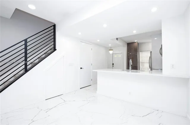 a view of kitchen with wooden floor