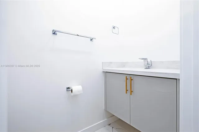 a bathroom with a sink and mirror