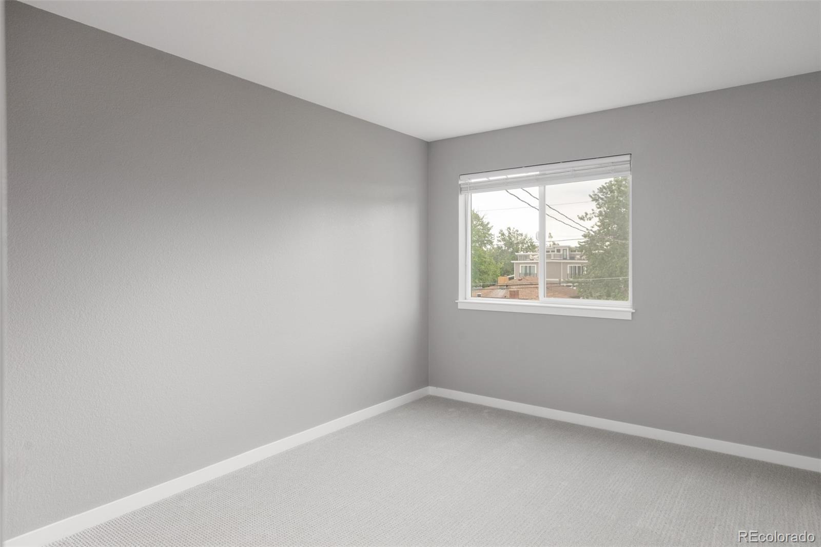 5230 Stuart Street Denver, CO 80212 - Photo 22 of 34 an empty room with a window
