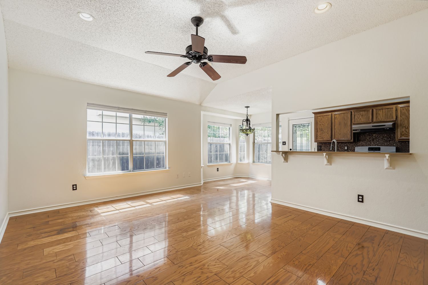1708 Rusty Nail Loop Round Rock, TX 78681 - Photo 2 of 13 a view of empty room with wooden floor and windows