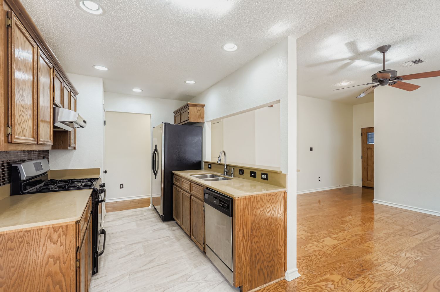 1708 Rusty Nail Loop Round Rock, TX 78681 - Photo 4 of 13 a kitchen with a stove and a refrigerator