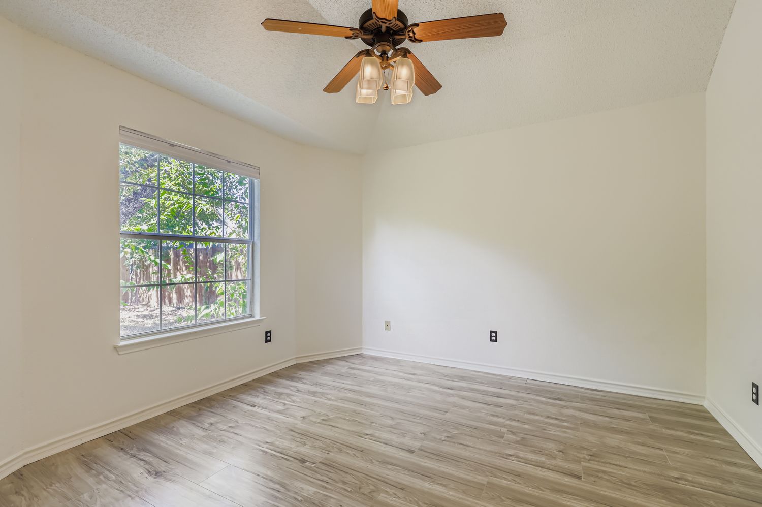 1708 Rusty Nail Loop Round Rock, TX 78681 - Photo 6 of 13 wooden floor in an empty room with a window