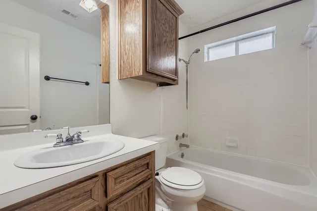 a bathroom with a sink toilet and a bathtub