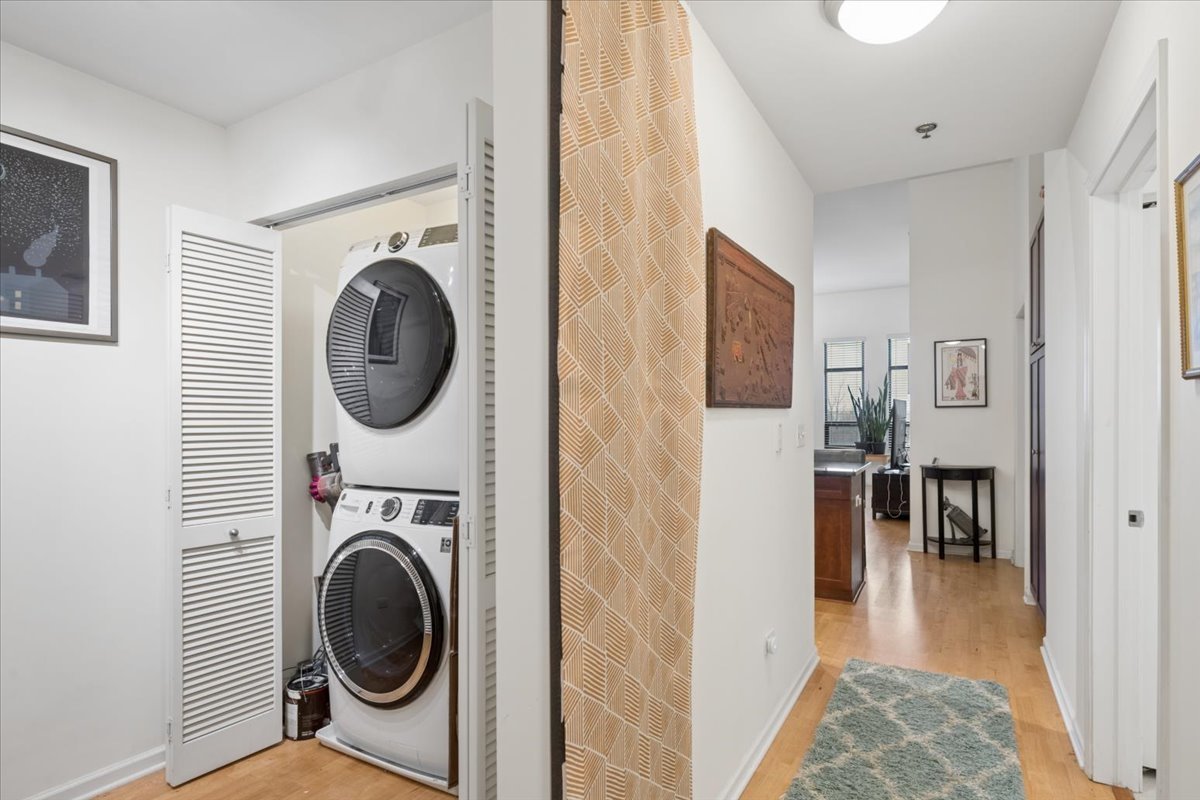 1255 South State Street, Unit 502 Chicago, IL 60605 - Photo 10 of 13 a view of a hallway with washer and dryer