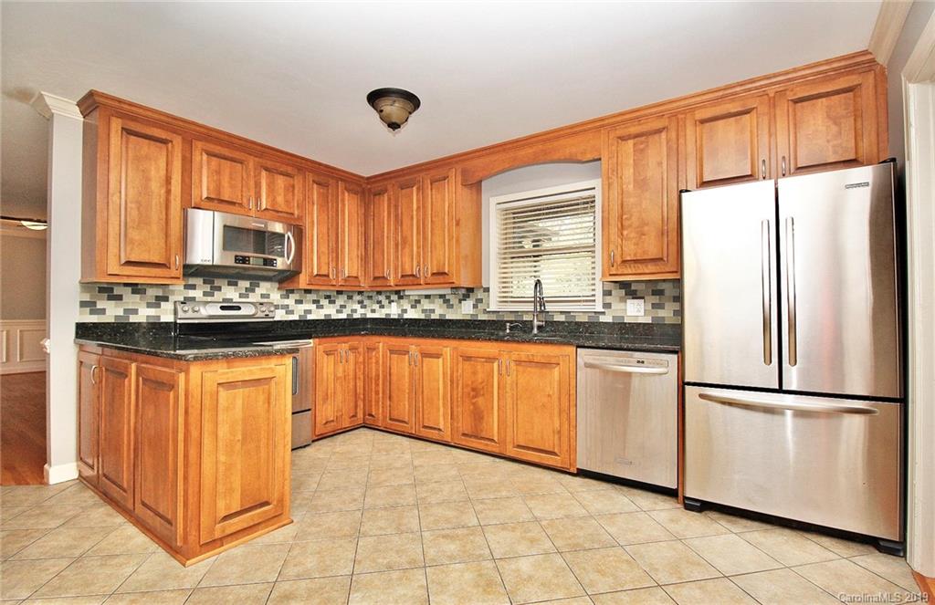 3399 Pleasant Road Fort Mill, SC 29708 - Photo 2 of 48 a kitchen with stainless steel appliances granite countertop a refrigerator a sink and a stove