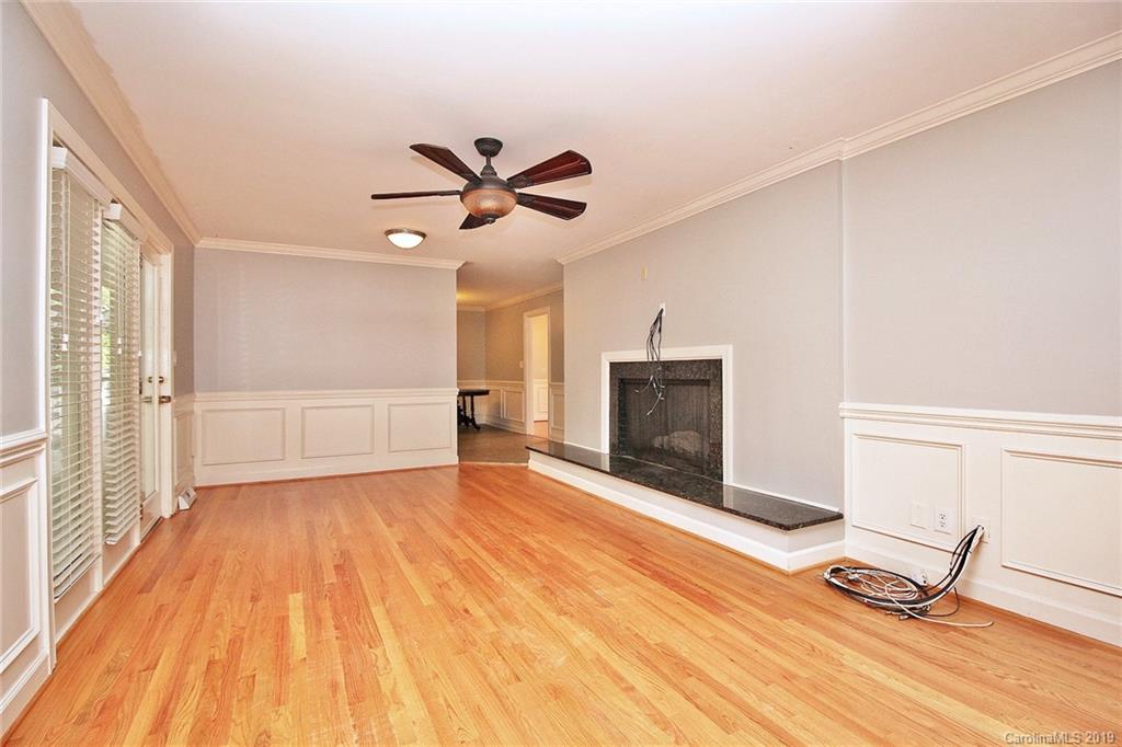 3399 Pleasant Road Fort Mill, SC 29708 - Photo 11 of 48 a view of a livingroom with wooden floor and a fireplace