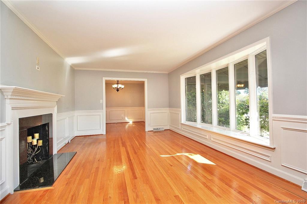3399 Pleasant Road Fort Mill, SC 29708 - Photo 12 of 48 a view of empty room with wooden floor and fireplace