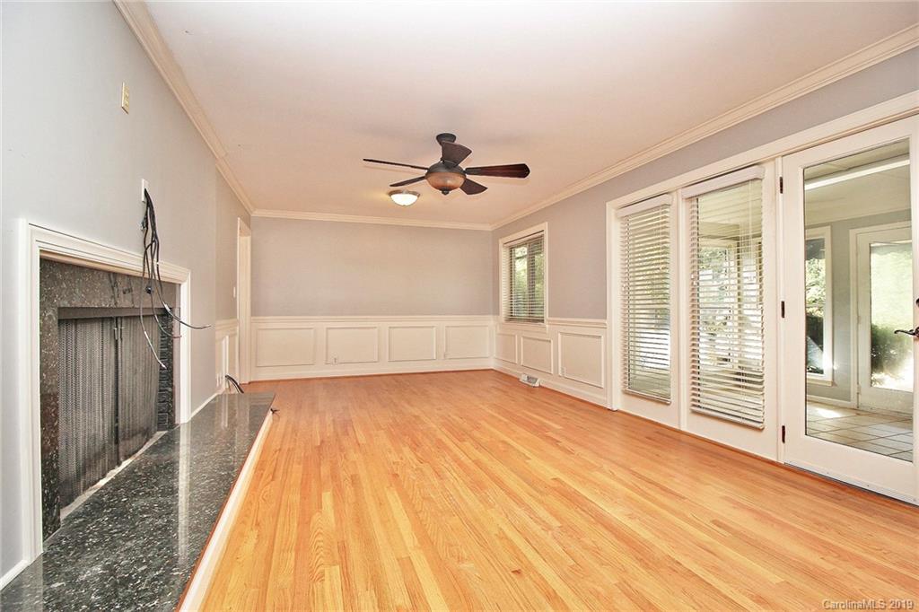 3399 Pleasant Road Fort Mill, SC 29708 - Photo 13 of 48 wooden floor in an empty room with a window