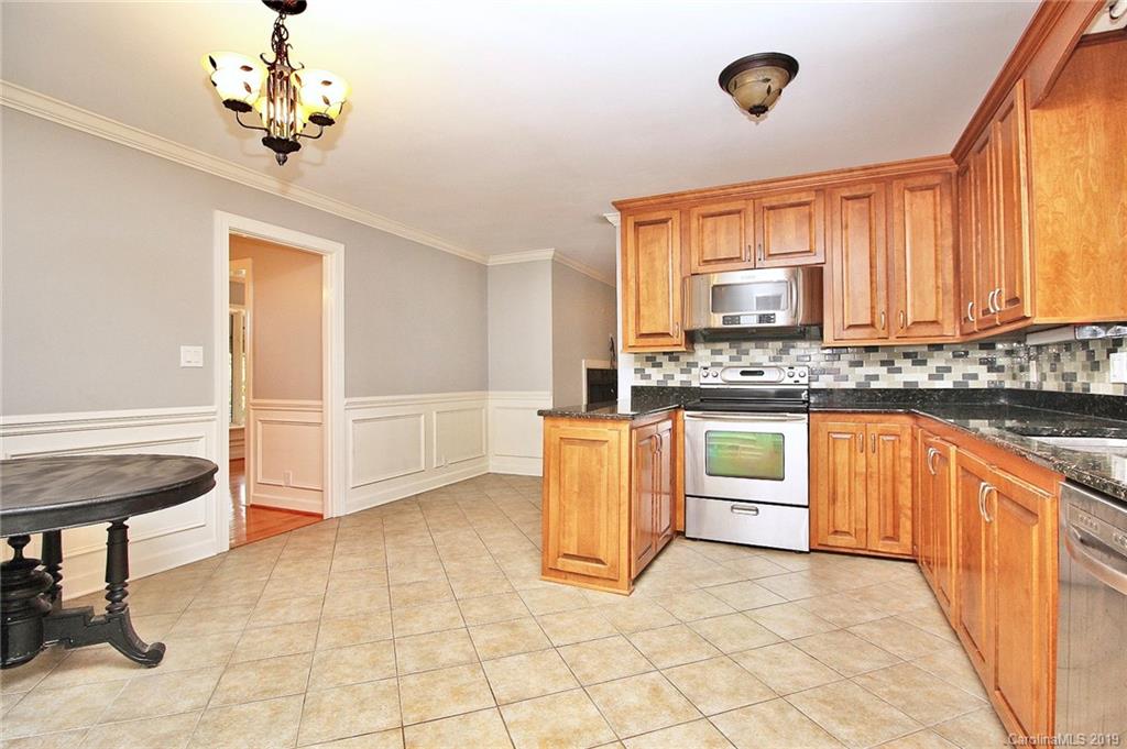 3399 Pleasant Road Fort Mill, SC 29708 - Photo 16 of 48 a kitchen with a stove a sink and a refrigerator
