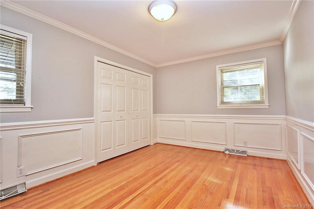 3399 Pleasant Road Fort Mill, SC 29708 - Photo 19 of 48 an empty room with wooden floor and windows