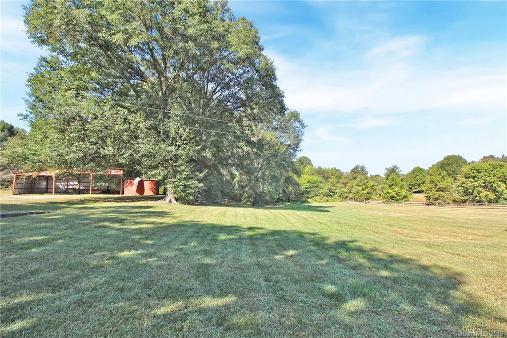 3399 Pleasant Road Fort Mill, SC 29708 - Photo 5 of 48 a view of a big yard with an trees