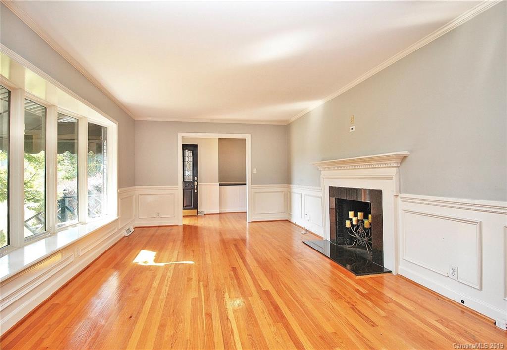 3399 Pleasant Road Fort Mill, SC 29708 - Photo 7 of 48 a view of empty room with wooden floor and fireplace