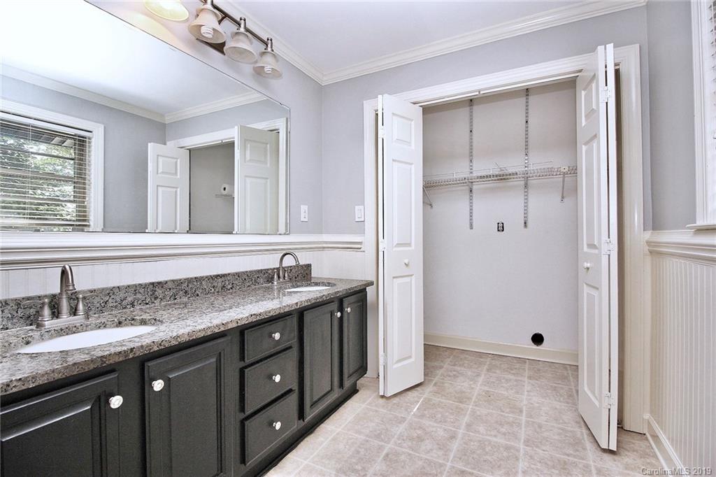 3399 Pleasant Road Fort Mill, SC 29708 - Photo 8 of 48 a bathroom with a granite countertop sink a mirror and a