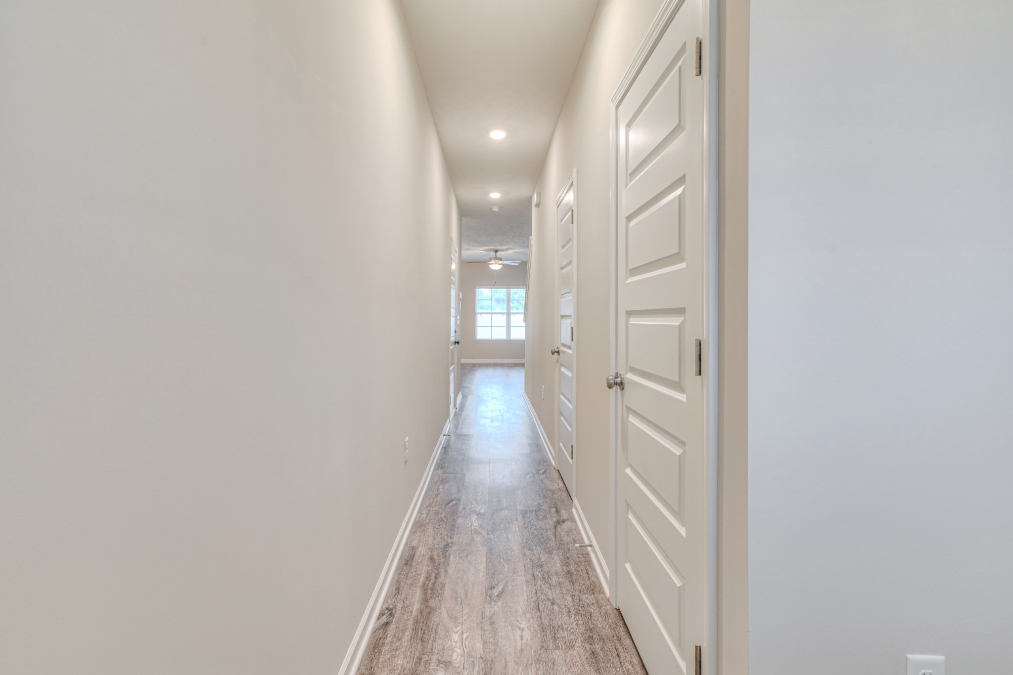 4319 Spyglass Drive Murfreesboro, TN 37127 - Photo 3 of 21 a view of a hallway with wooden floor and a bathroom