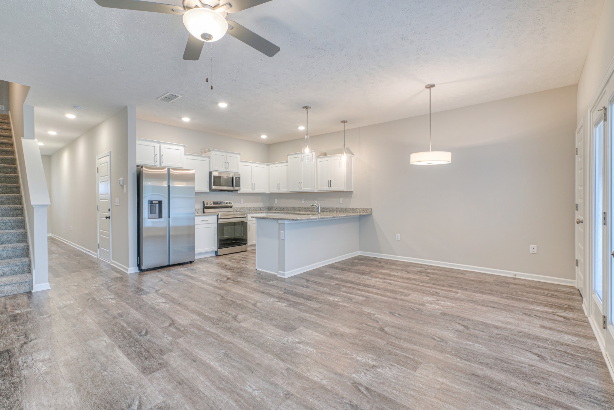 4319 Spyglass Drive Murfreesboro, TN 37127 - Photo 5 of 21 a view of kitchen with refrigerator stove and wooden floor